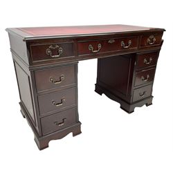 Georgian design mahogany twin pedestal desk, the top with inset red oxblood leather writing surface, fitted with nine cock-beaded and graduating drawers