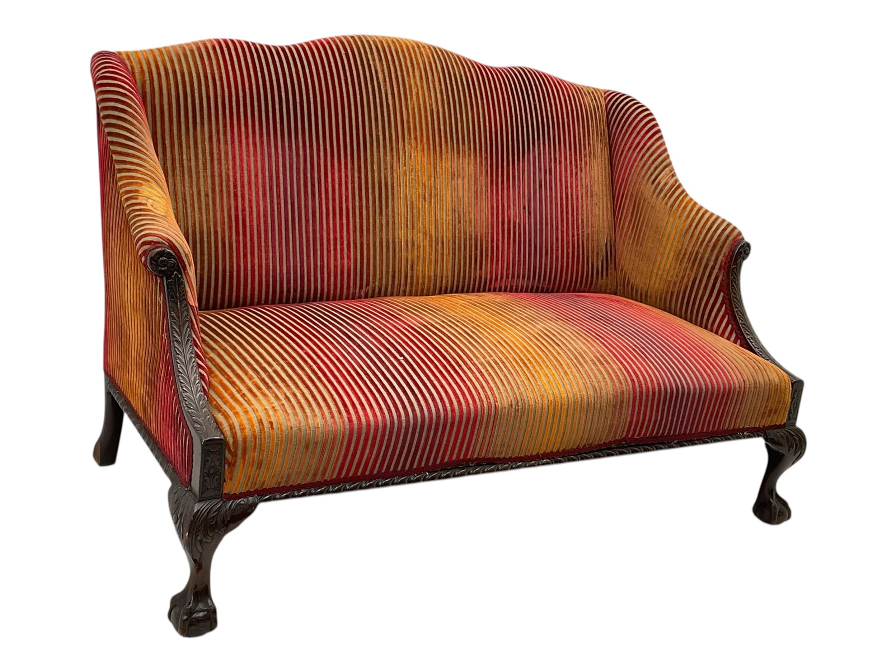 Mid-19th century mahogany two-seat sofa, upholstered in striped velvet fabric, the shaped backrest leading to outward-curved arms, carved apron with scrolling foliate details, raised on cabriole supports terminating in claw and ball feet
