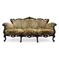 Victorian design stained wood three seater settee, top rail carved and scrolled, padded ba...