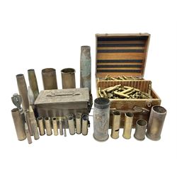 Large collection of shell and bullet casings, including a trench art example, together with a metal cartage case and wooden case