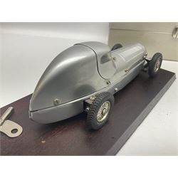 Marklin tin-plate clockwork Mercedes-Benz W25 racing car with driver in hinged cockpit model no.1096; fitted on mahogany base L33cm; in original metallic silver box with key