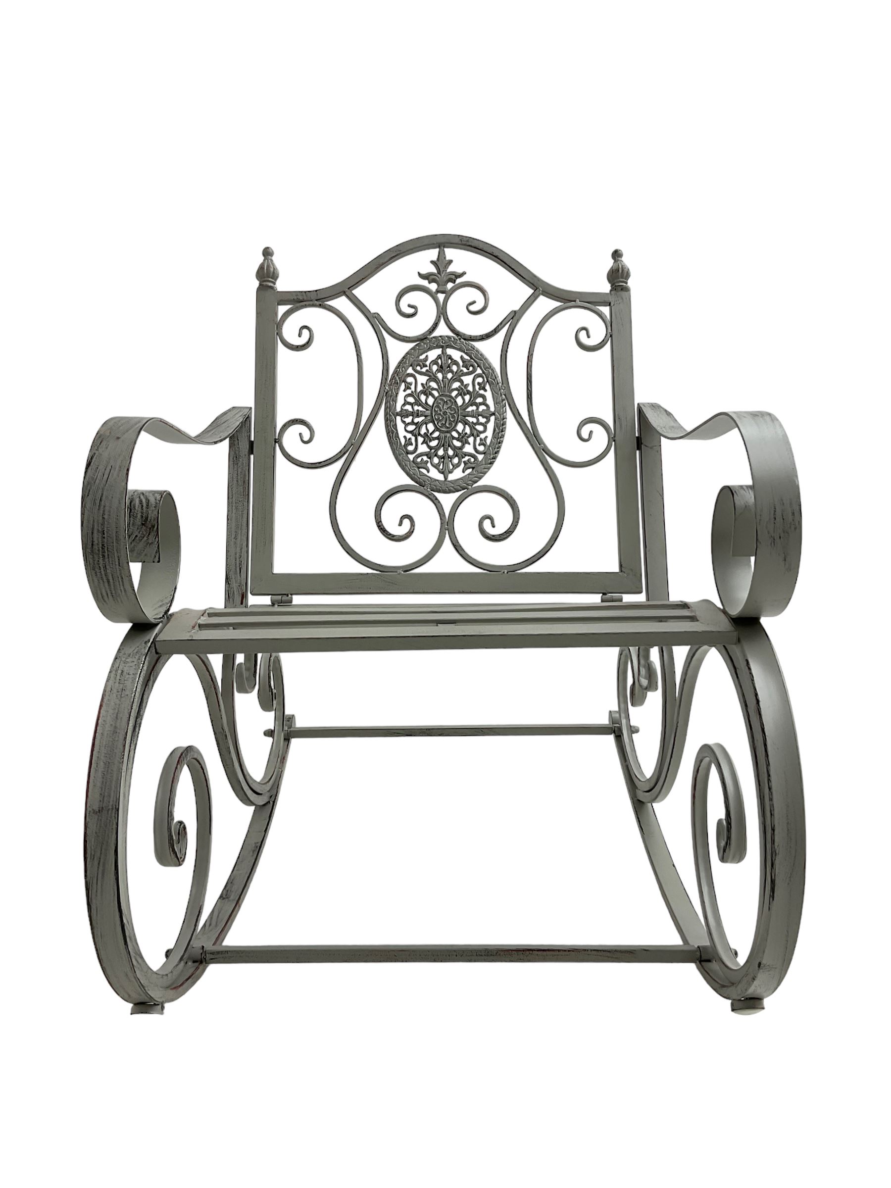 Regency design wrought metal rocking garden bench armchair, pierced back with scroll design and central foliate medallion over strap seat, with C-scroll arms and supports, in antique grey finish