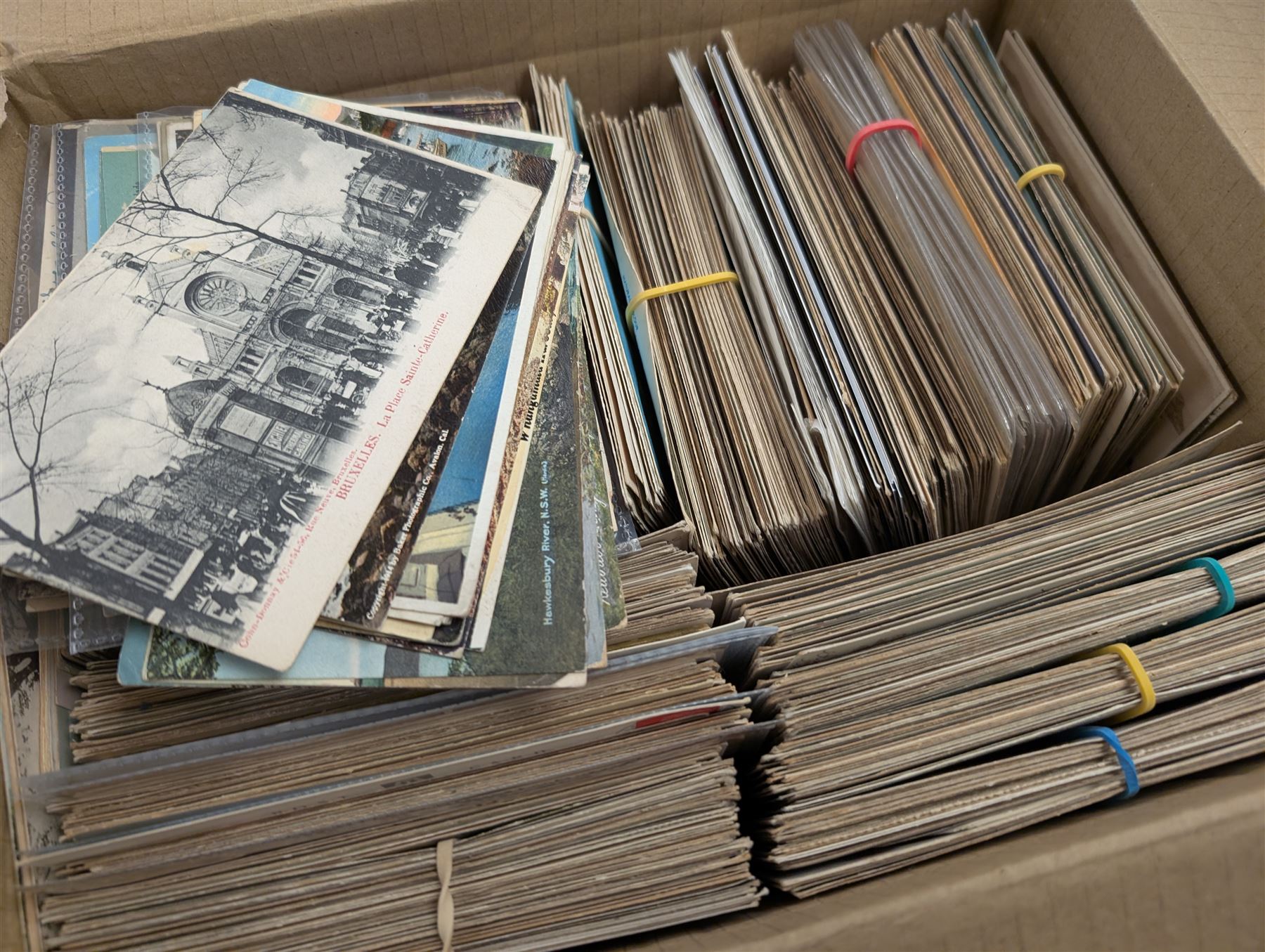 Collection of postcards, mostly early 20th century examples, in two boxes