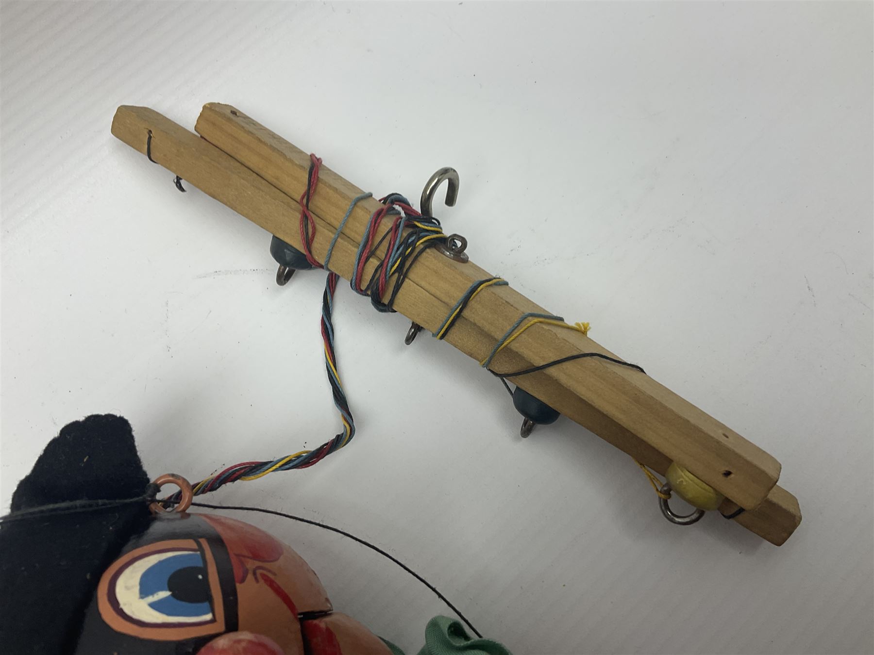 Pelham Puppet - a rare type SM Harlequin circa 1950s with painted black face mask, black felt hat, green ruff and red white chequered suit, H31cm; in original box with instructions 