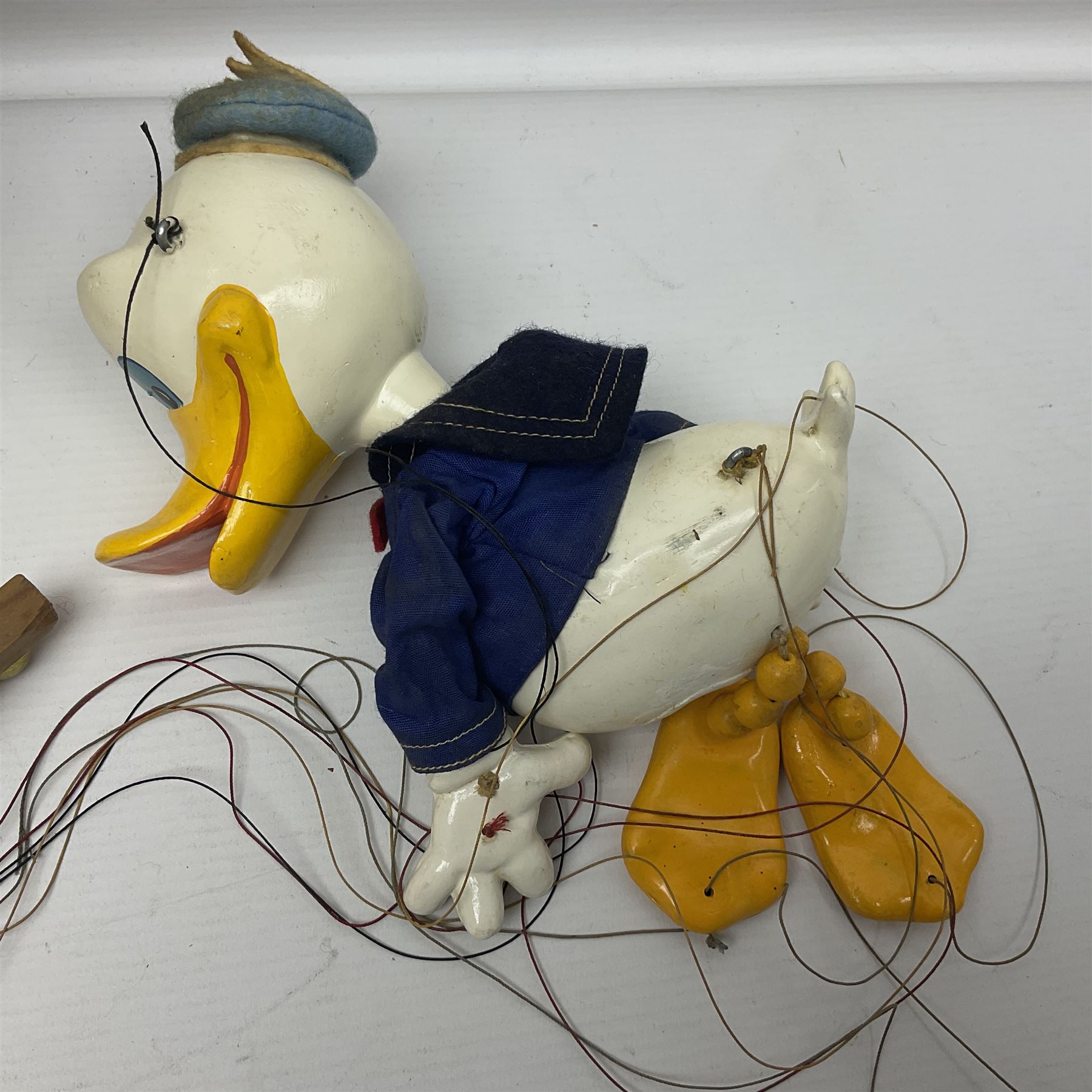 Two Pelham Puppets - The Magic Roundabout Mr. Rusty pole puppet with wool hands and blue  coat dated 1963; boxed; and Type SL Disney Donald Duck; unboxed (2)