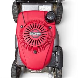Honda -  GCV160 petrol lawnmower, Izy model, with rear grass collector, grey deck and red engine cover.