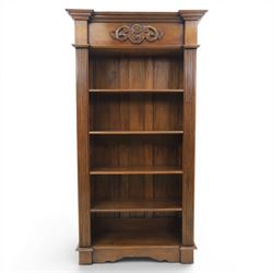 Hardwood open bookcase, fitted with five open shelves, applied carving to top facia