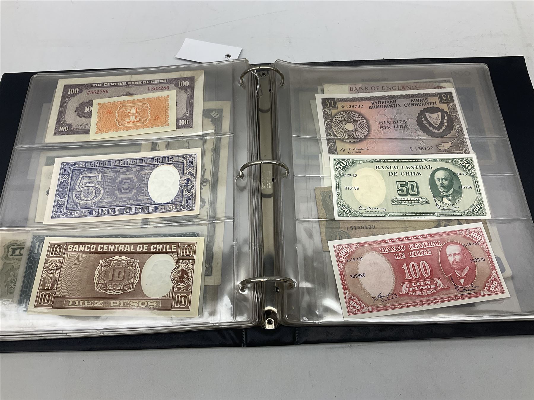 World banknotes, including Queen Elizabeth II The States of Jersey one pound 'DB202703', five pounds 'BB527762' and ten pounds 'AB651481', reserve bank of New Zealand two dollars '1L3 741894', King George V Straits Settlements one dollar 1st January 1935 'F/83 28924', various Bank of England notes etc, housed in two ring binder albums