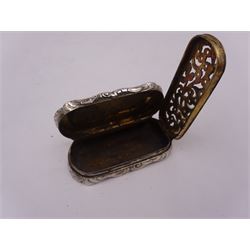 Victorian silver vinaigrette, of oval form with shaped rim, with engraved scrolling and foliate decoration and cartouche with initials, with foliate pierced gilt interior, hallmarked David Pettifer, Birmingham 1855, L4.3cm
