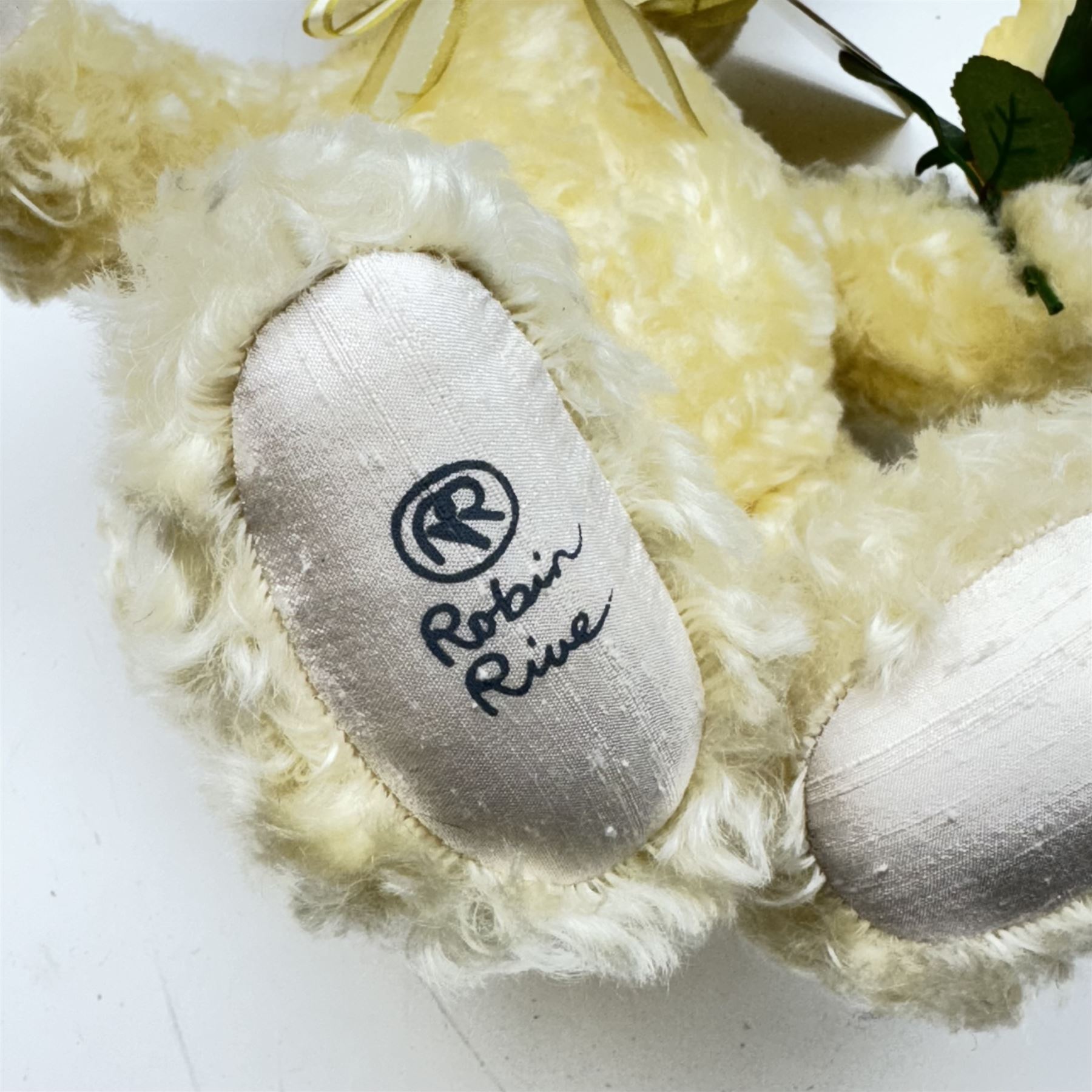 Three limited edition Robin Rive teddy bears to include 'Peace' a yellow mohair bear holding a yellow rose limited edition no.4/200, 'Tuddles' a musical grey mohair bear limited edition no.9/100 and 'Sally & Her Bear' a blonde mohair bear with crocheted teddy bear limited edition no.143/300, all with certificate tags, tallest H41cm 
