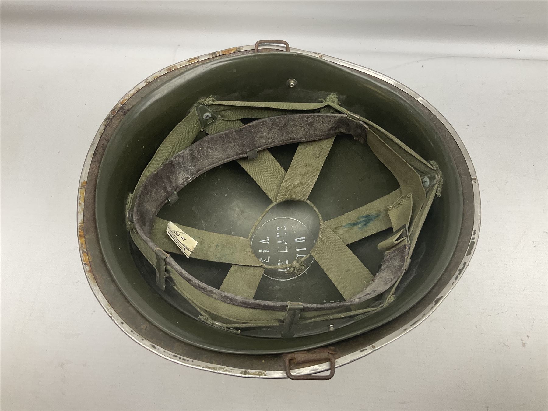 1950s French Algerian War steel helmet with liner; indistinctly marked 'S.I.A. LE EANS(?) 71R'
