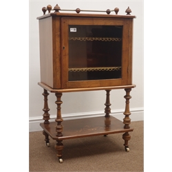  Late Victorian inlaid walnut music cabinet with brass gallery, glazed doors enclosing fitted shelve on  turned supports joined by an undertier, W59cm, H98cm, D39cm  