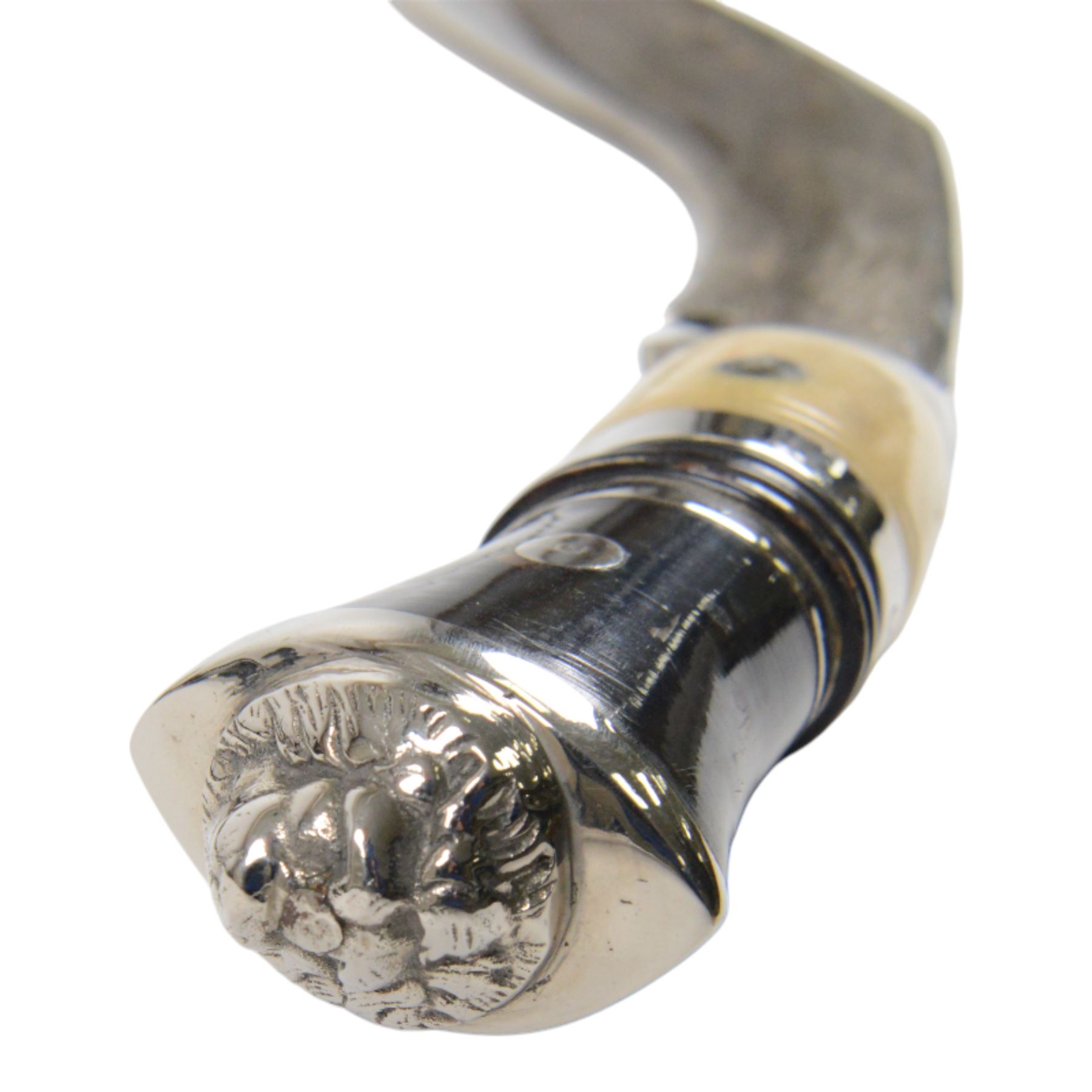 Pair of kukri knives, with with ebonised and bone handles, with two smaller knives, with a leather scabbard with floral silvered decoration, L44cm