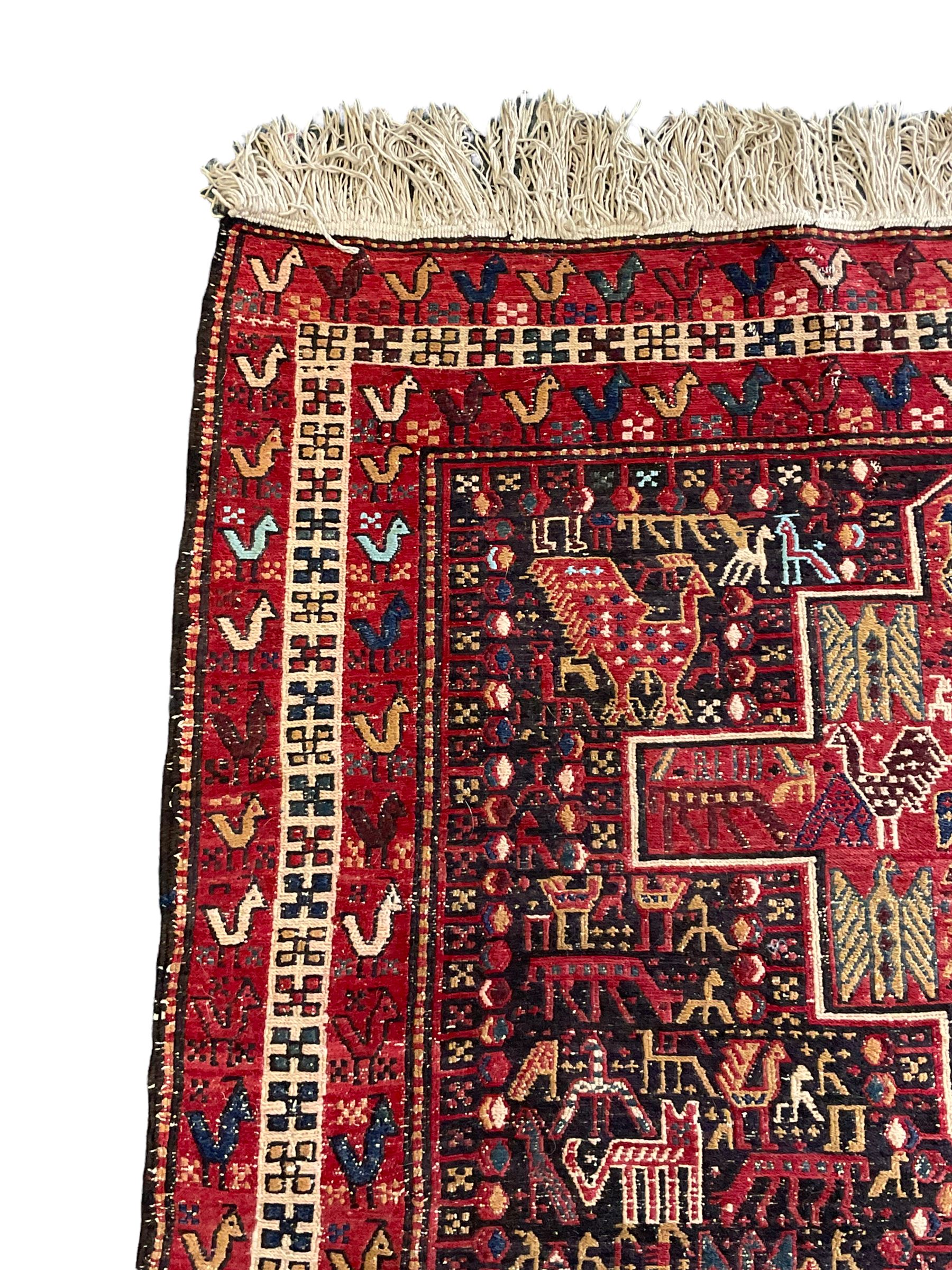 North African flat-woven rug, decorated with small stylised animal and bird motifs, five geometric star medallions