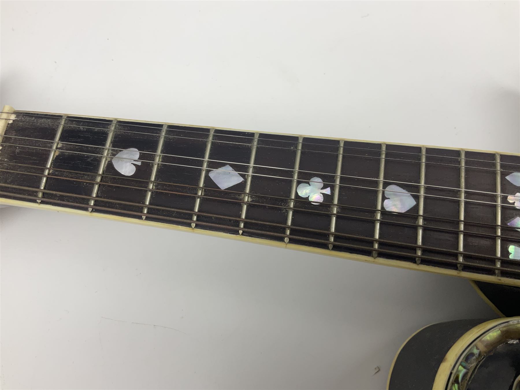 Eastern F-hole eight-string mandolin with black finish and mother-of-pearl inlay of a man riding a winged horse/unicorn amongst clouds and stars with playing card suits to the fingerboard L71cm