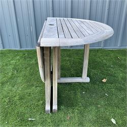 Circular, foldable teak slatted garden table - THIS LOT IS TO BE COLLECTED BY APPOINTMENT FROM DUGGLEBY STORAGE, GREAT HILL, EASTFIELD, SCARBOROUGH, YO11 3TX