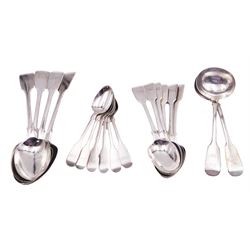 Group of Victorian silver fiddle pattern spoons, comprising pair of sauce ladles and set of six teaspoons, both hallmarked Henry Holland (of Holland, Aldwinckle & Slater), London 1857, set of four table spoons, hallmarked Chawner & Co (George William Adams), London 1857, and set of six dessert spoons, hallmarked Chawner & Co (George William Adams), London 1856, with monogrammed terminals, approximate total silver weight 25.50 ozt (792.6 grams)