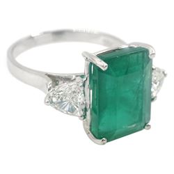 White gold three stone large emerald and trillion cut diamond ring, stamped 18K, emerald approx 3.50 carat, total diamond weight approx 0.75 carat