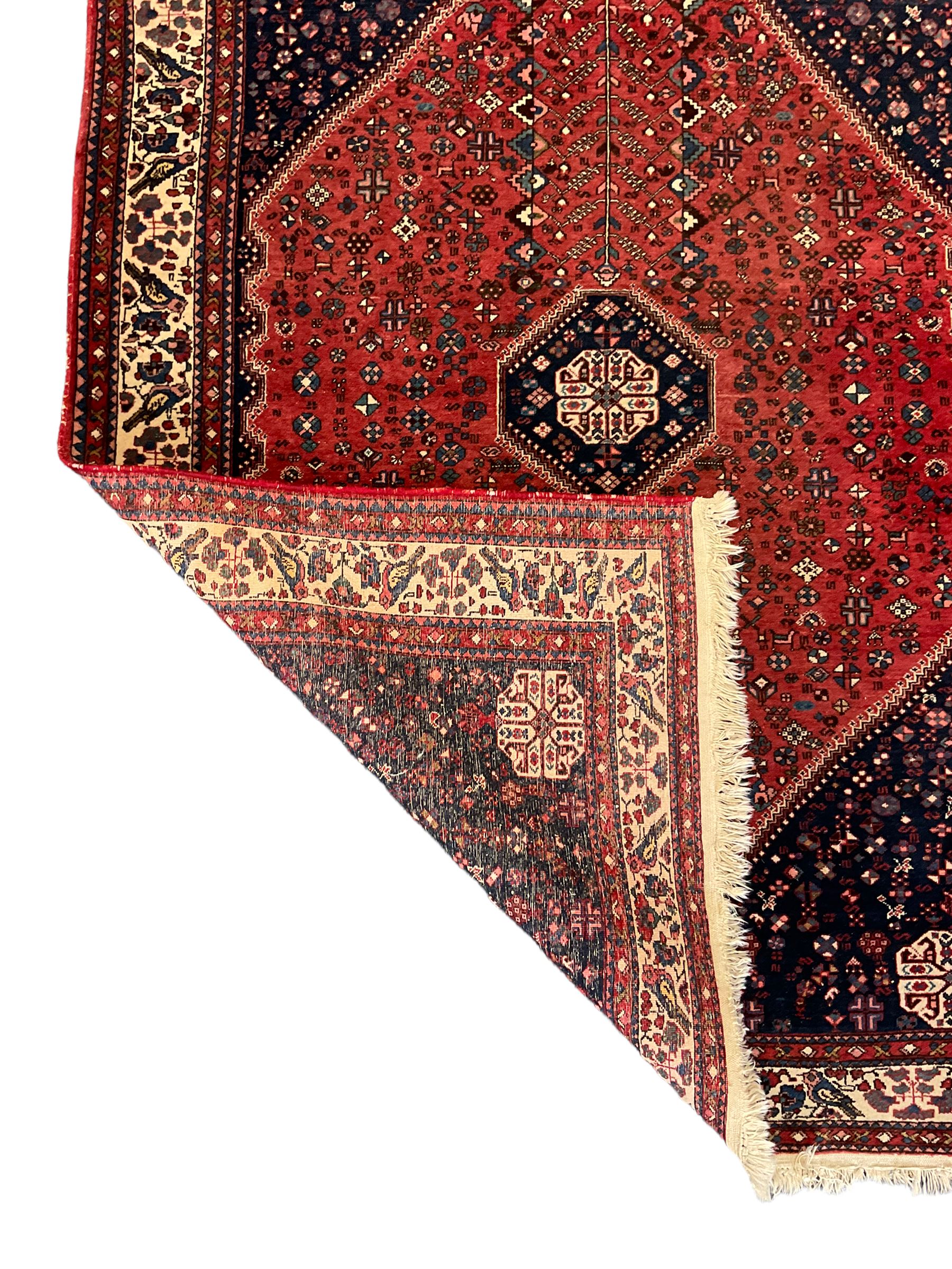 Fine Persian blue and red ground woollen rug