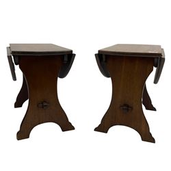 Pair of early 20th century mahogany drop leaf occasional tables, with stretcher base