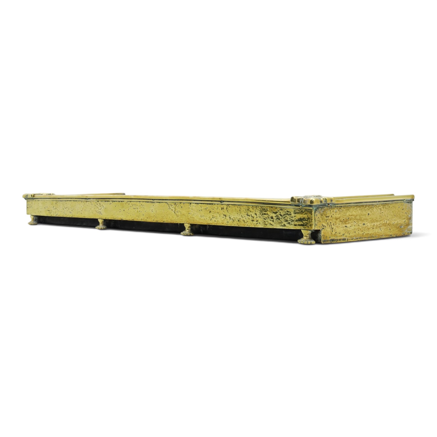 Two Edwardian brass fire curbs, comprising a decorative example with pierced vertical frieze, applied Tulips (H 21cm, W 126cm, D 32cm), together with a hammered moulded example with acanthus corners (H 12cm, W 138cm, D 37cm)