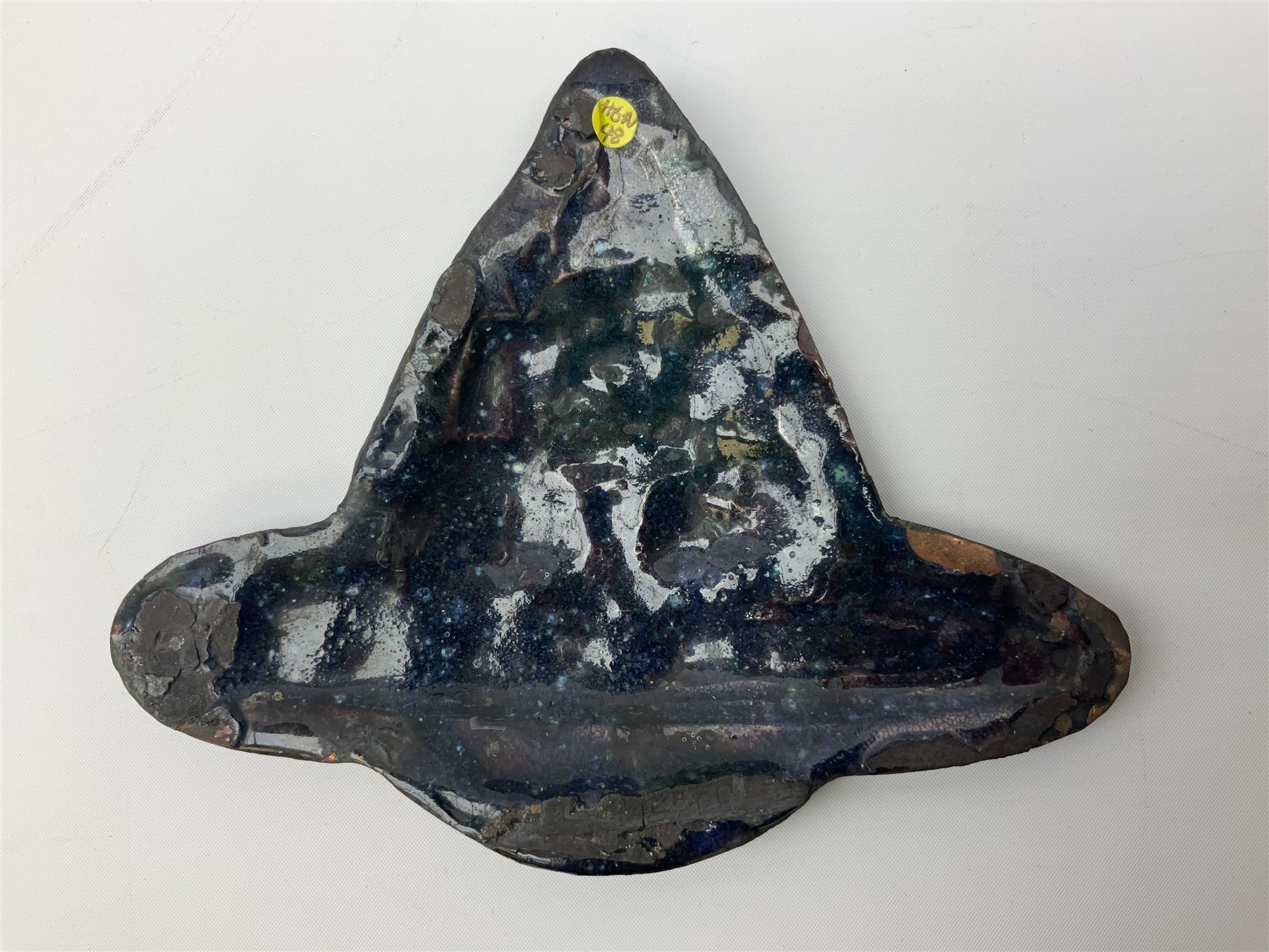 Henry George Murphy (1884-1939), Arts & Crafts enamel panel, of stylised form decorated with a stylised temple on a hill, upon a blue toned ground, H13cm W15cm