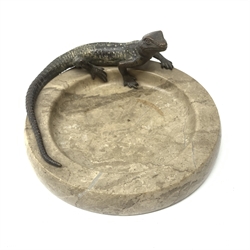 A cold painted bronze Australian lizard, mounted upon a polished stone dish, D15.5cm. 
