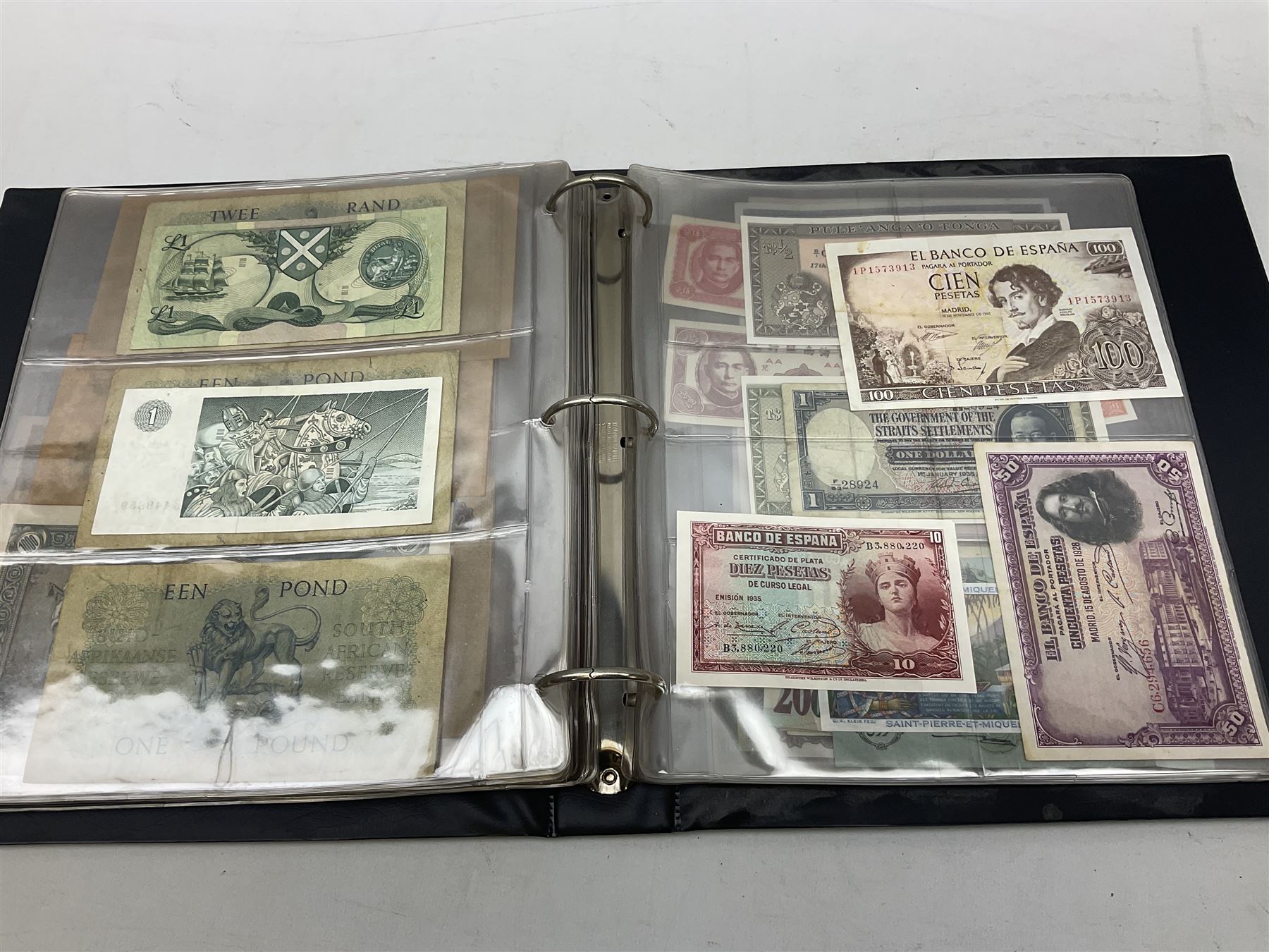World banknotes, including Queen Elizabeth II The States of Jersey one pound 'DB202703', five pounds 'BB527762' and ten pounds 'AB651481', reserve bank of New Zealand two dollars '1L3 741894', King George V Straits Settlements one dollar 1st January 1935 'F/83 28924', various Bank of England notes etc, housed in two ring binder albums