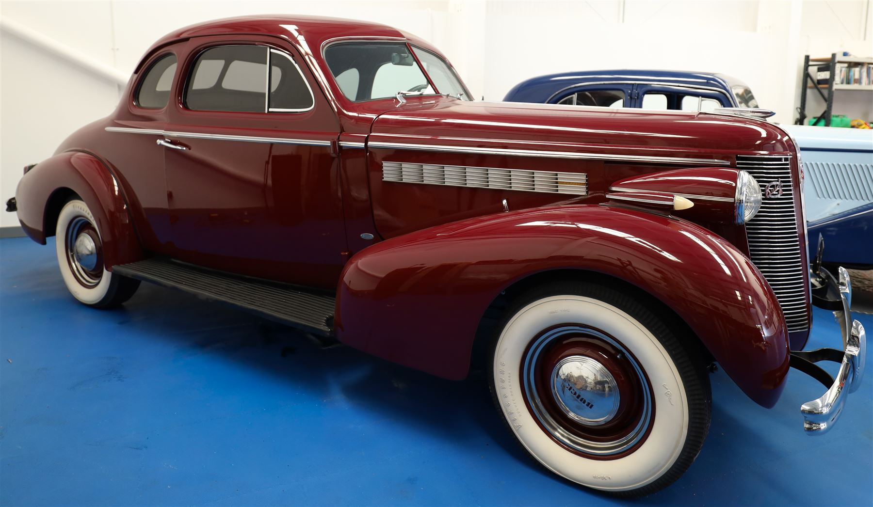 1937 Buick Special Sport Coupe

Registration: LXS 932
Serial number: 744273817
Engine: 4,064cc straight-eight petrol
Odometer reading: 6,476 miles
Steering: Left-hand drive
Colour: Deep maroon
V5C: Present
Keys: One

From the Estate of the late John Sils.

A striking 1937 Buick Special Sport Coupe, finished in deep maroon and manufactured at the General Motors plant in Oshawa, Ontario, Canada.

The Buick Special formed part of the marque’s Series 40 range and combined dramatic period styling with Buick’s smooth 248cu in, approximately 4,064cc, straight-eight engine. The Sport Coupe was among several body styles offered for 1937 and is distinguished by its sweeping wings, prominent vertical grille, split windscreen and enclosed rear luggage compartment.

This example was imported into the United Kingdom and first registered here in November 2019, receiving the registration LXS 932. The odometer displays 6,476 miles, although this mileage has not been independently verified.

The car is very well presented throughout, with excellent deep-maroon paintwork, extensive brightwork and a highly detailed period Art Deco interior featuring its dashboard, centrally mounted ventilation grille, original-style instrumentation and controls. The luggage compartment is neatly trimmed and incorporates a securely mounted spare wheel beneath a raised floor.

The underside also presents particularly well, appearing clean and extensively finished in black, with the chassis, suspension, axles and associated components showing evidence of careful restoration and ongoing maintenance.

Overall, this is an impressive and imposing pre-war Buick, presented in very good condition throughout.

Features

• Canadian-built Buick Special Sport Coupe
• Manufactured at General Motors, Oshawa, Ontario
• 4,064cc straight-eight engine
• Left-hand drive
• Deep-maroon exterior finish
• Extensive chrome brightwork
• Split windscreen
• Period Art Deco interior
• Original-style dashboard and instrumentation
• Dashboard-mounted clock
• Front bench seating
• Enclosed rear luggage compartment
• Underfloor spare wheel
• UK registered since November 2019
• V5C present
• One key

Condition

Presented in very good condition throughout, with excellent paintwork and a clean, highly detailed underside.

This vehicle forms part of the Estate of the late John Sills and is offered for sale by the Executors, providing a genuine reason for sale.