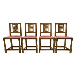 'Squirrelman' set eight oak chairs, carved and pierced lattice backs, red leather studded seat cushions, on octagonal supports joined by stretchers, by Wilf Hutchinson of Husthwaite
