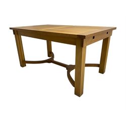 Barker & Stonehouse - oak extending dining table, on solid supports joined by curved stretchers, two additional leaves