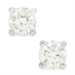 Pair of 18ct white gold diamond stud earrings, each stud set with a round brilliant cut di...