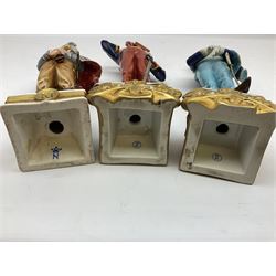 Group of seven Capodimonte figures of soldiers, to include four Bruno-Merli examples including Officer of the 12th Lancers 1820 and Captain of the 18th Hussars 1815, both raised upon ornate gilt plinths bearing British monarch motto in Latin 'Dieu et mon droit', and three further similar, all with crowned N mark beneath, tallest H32cm