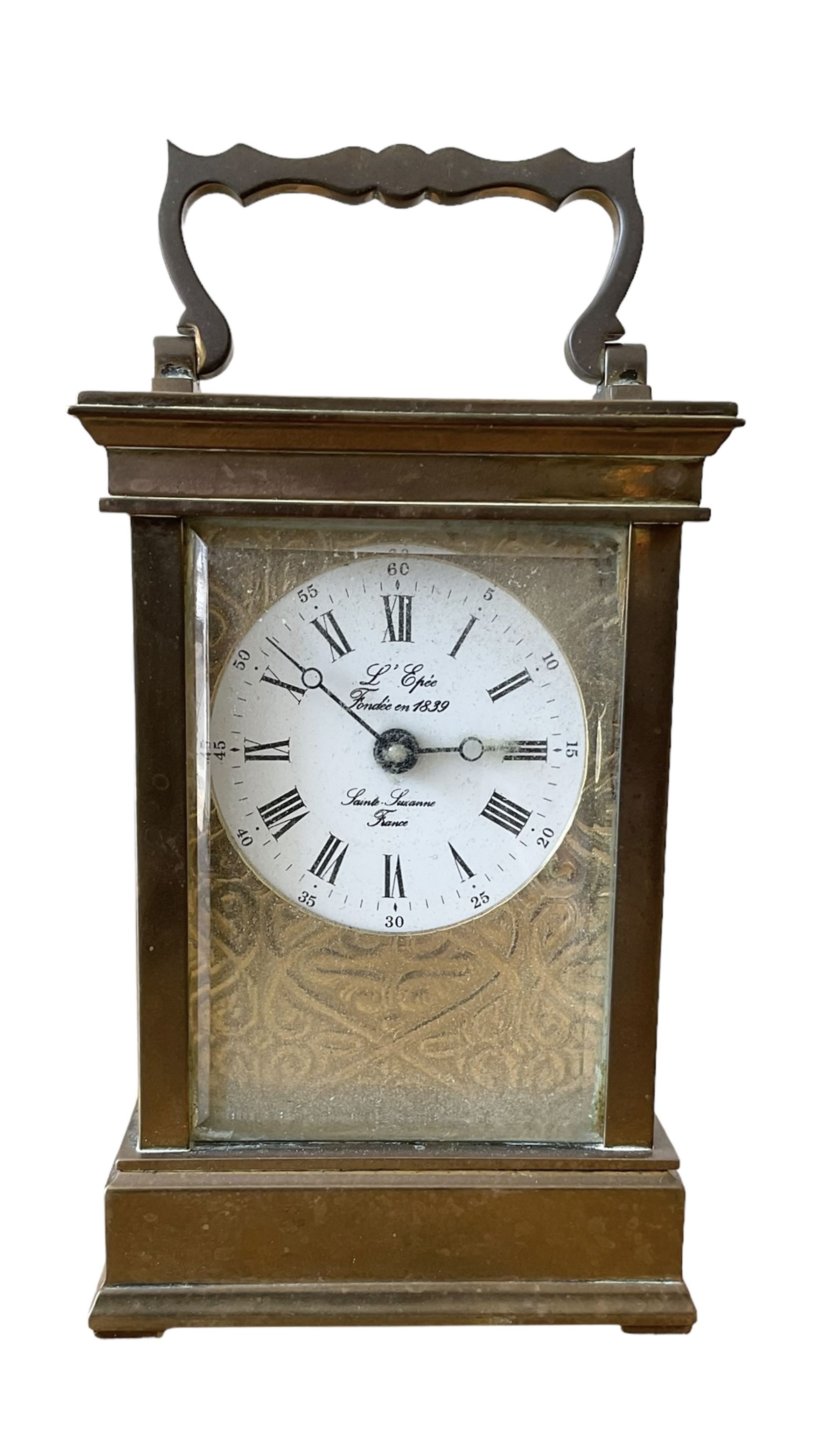 French -  brass cased 20th century  8-day timepiece carriage clock, dial inscribed L' Epee Fondee-En 1839, Sainte Suxanne, France, with a circular enamel dial and an embossed brass dial mask, Roman numerals, minute markers, five minute Arabic's and steel moon hands, with a jewelled lever platform escapement.