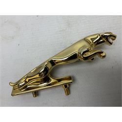 Gold plated leaping Jaguar car mascot, no.7'24265'3WB L12.5cm; three AA car badges and Veteran Motorists car badge; and quantity of 1950s fuel and general ration books