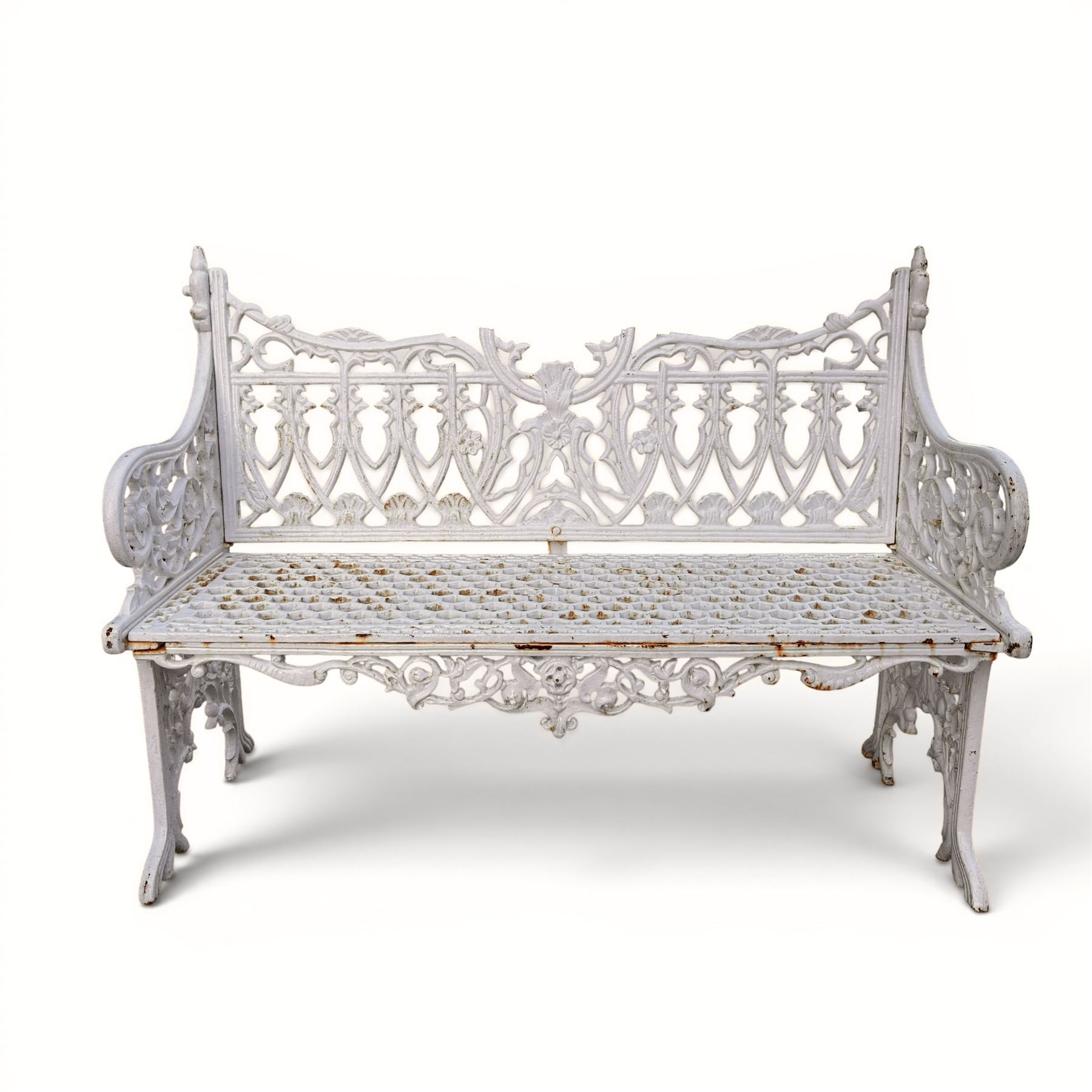 Victorian revival heavy cast iron garden bench, ornate back rest with scrolls, floral motifs and central crest, pierced lattice seat, curved arms and decorative legs, painted in antique white, in the Gothic Coalbrookdale style - Damaged 