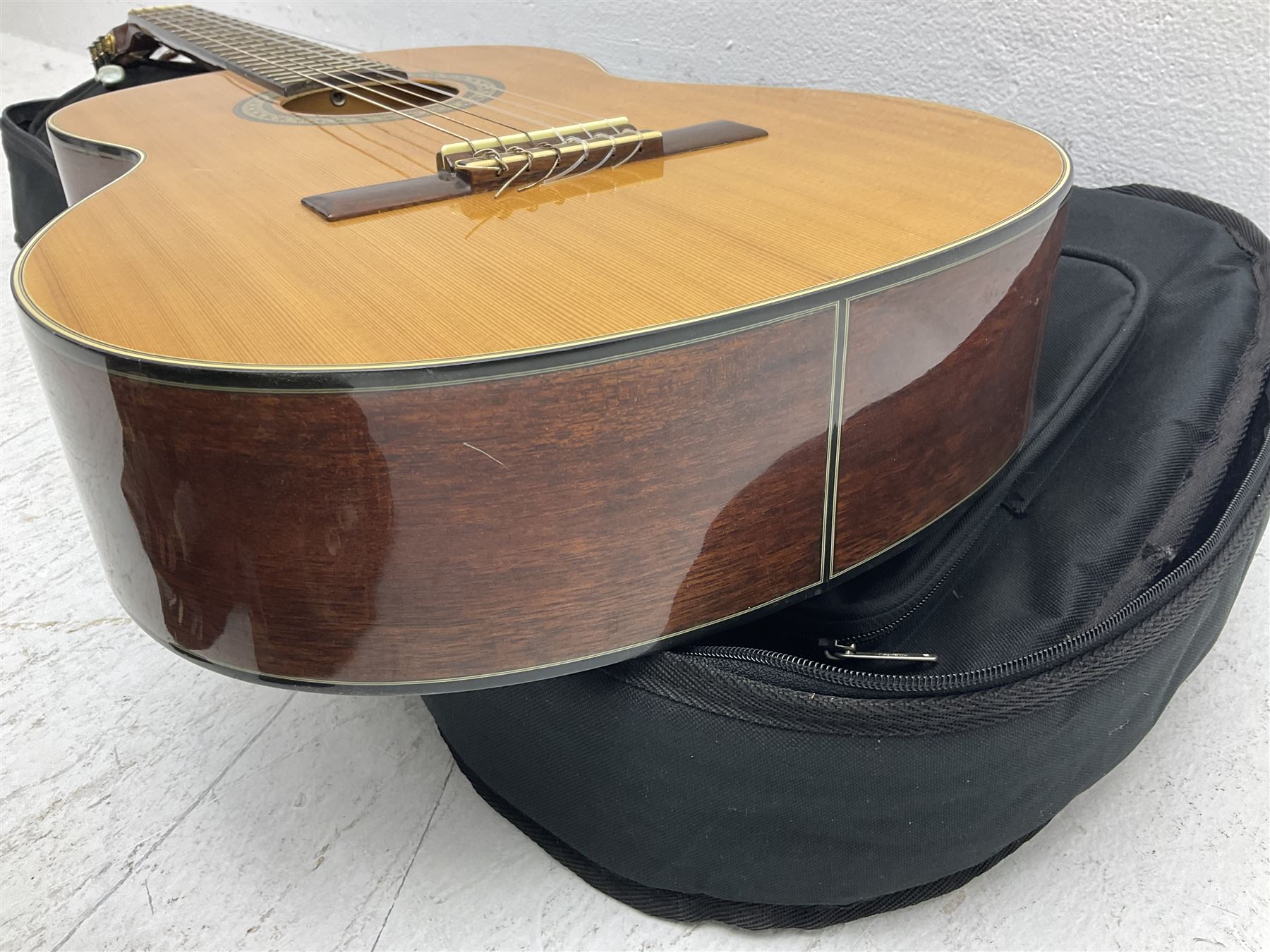 Nagoya Suzuki Model SC240 acoustic guitar with mahogany back and ribs and spruce top, bears label, L101cm; in soft carrying case