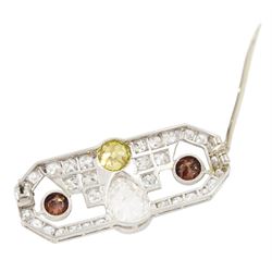 Early 20th century platinum diamond brooch, milgrain set with a pear cut faint brown diamond of approx 1.50 carat, an old cut fancy yellow / green diamond of approx 0.70 carat, and two old cut fancy orange / brown diamonds of approx 0.40 carat and 0.35 carat, surrounded by old cut white diamonds in an openwork setting, total white diamond weight approx 1.45 carat