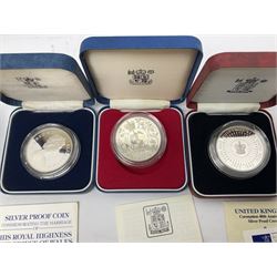 Seven The Royal Mint United Kingdom sterling silver proof crown coins, comprising two 1972, three 1977, 1981 and 1993, all cased with certificates and a Queen Elizabeth II 2001 one ounce fine silver Britannia coin on card (8)
