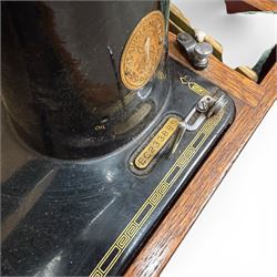 Three Singer wooden cased sewing machines 