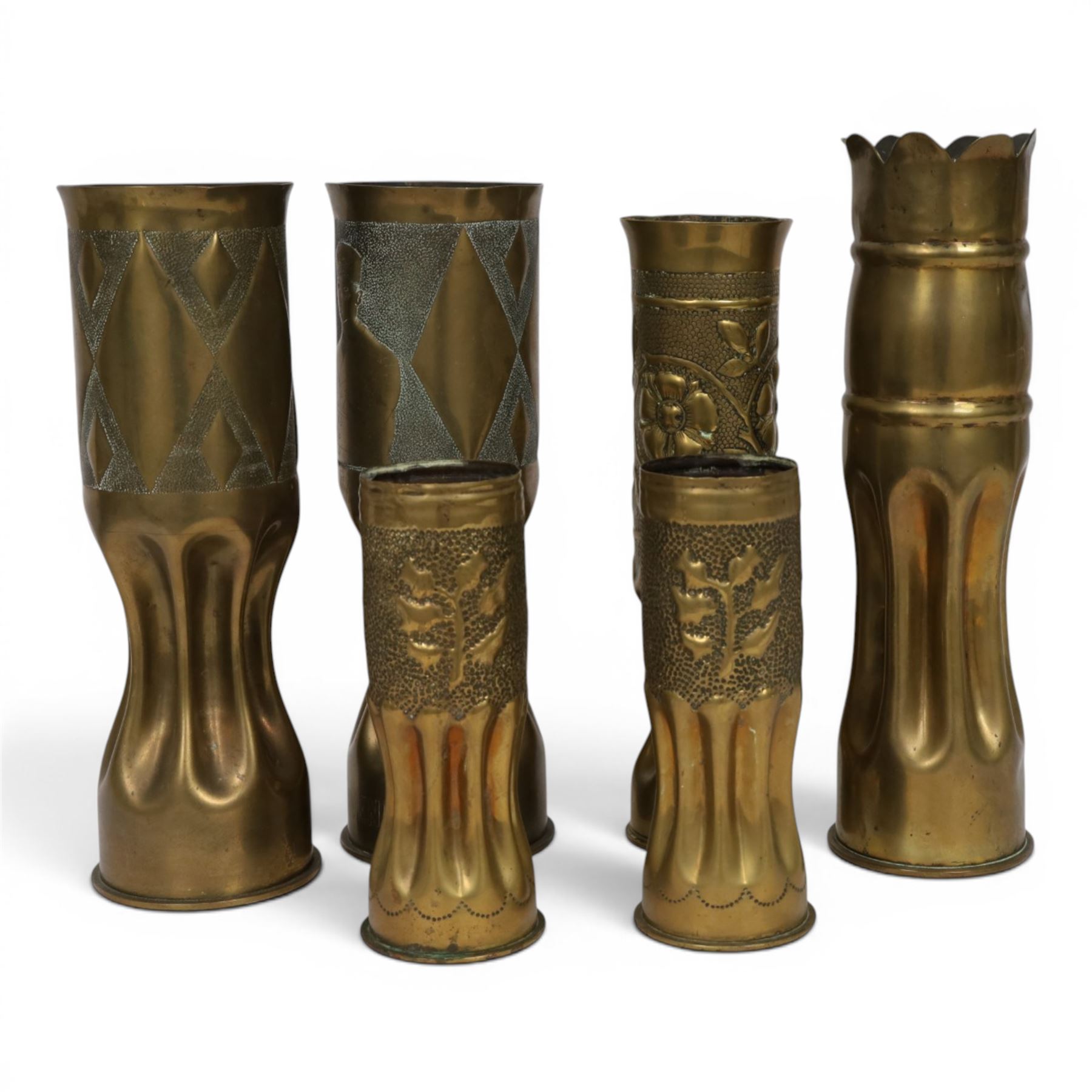 Pair of Second World War Trench Art M14 Shell Cases, each relief-decorated and engraved with a portrait of General de Gaulle, together with another pair decorated with lions and two others, largest H36cm 