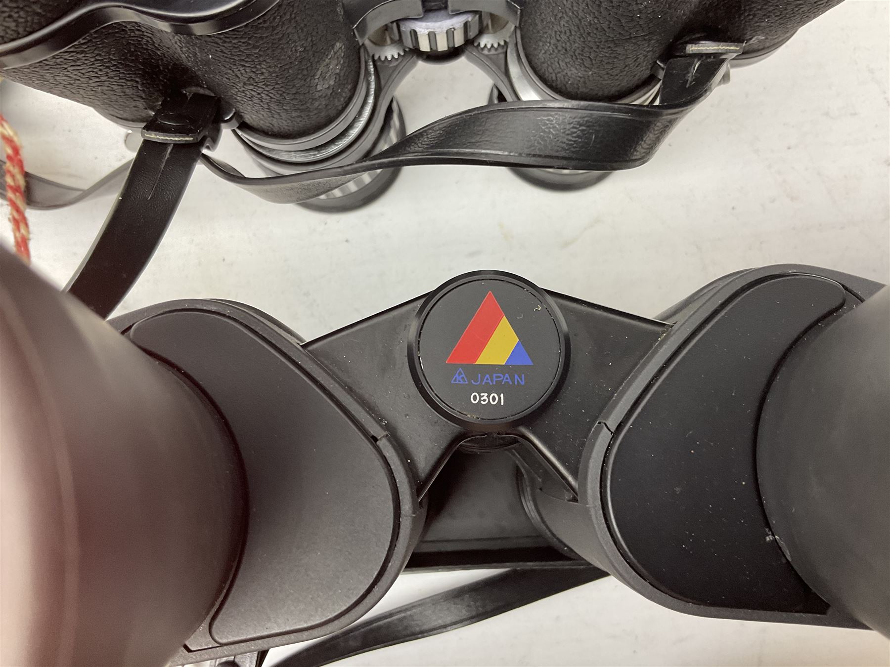 Eleven cased pairs of binoculars to include Summit 8x30,  Concord 8x40, Tasco no. 106 8x - 16x40, Chinon 10x50, Tokina 7x42 Field, Zoom 6x- 12x32 etc