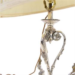Silver plated Egyptian Revival lamp, with scrolling columns, on a trefoil base, surmounted by three sphinxes, with mask feet, H60cm