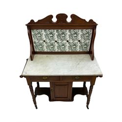 Edwardian walnut washstand, raised tiled back over marble top, the base fitted with two drawers and cupboard, turned supports with castors 