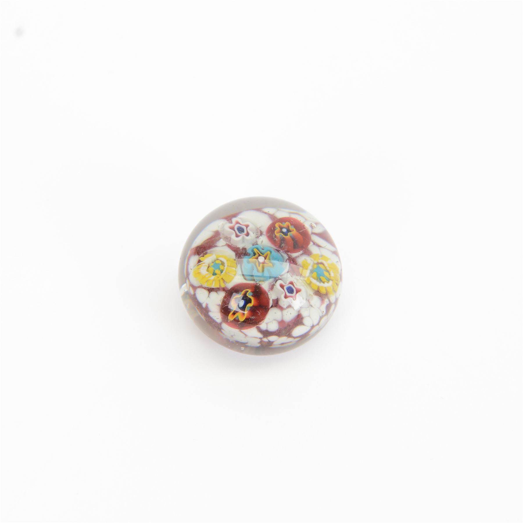 Nine miniature milleifiori paperweights including an example with twisted canes 
