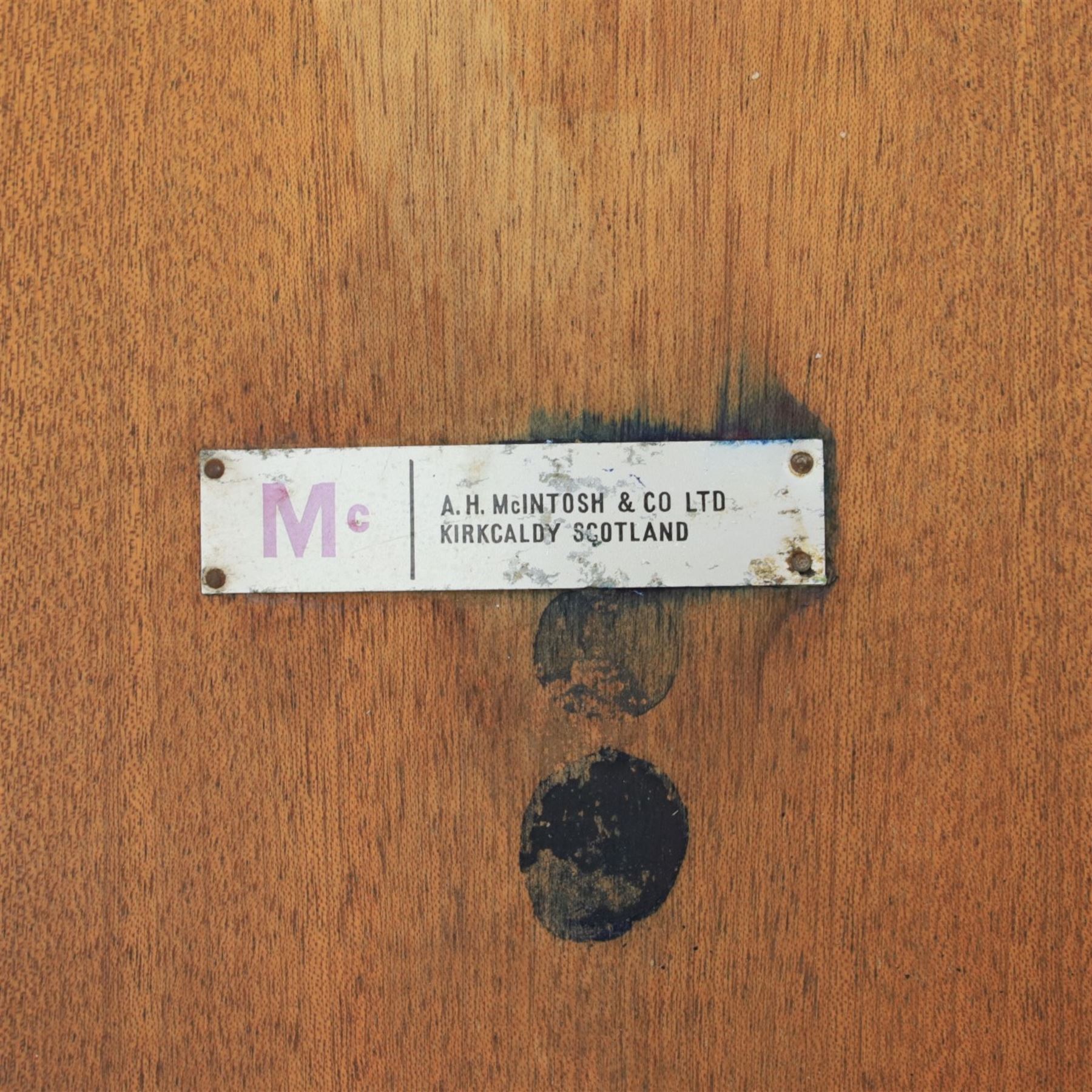 A H McIntosh & Co of Kirkcaldy - teak circular top with moulded edge enclosing butterfly leaf extension, raised on four tapering supports, extending action revealing central leaf, 167cm fully extended