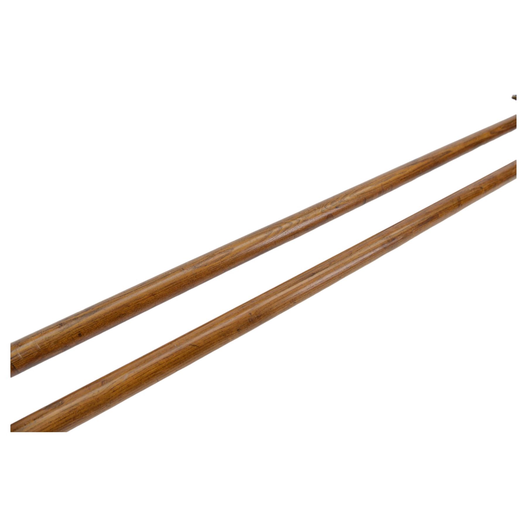 Pair of Halberds, with steel ends and wooden shafts, L245cm