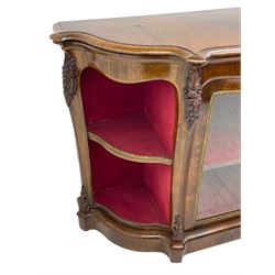 19th century rosewood buffet credenza, bombe form with shaped and moulded top, two central glazed doors with foliate moulded gilt slips, the red fabric-lined interior fitted with a single shelf, flanked by open shelves with raised gilt metal lips, the uprights decorated with shell and flower head carved cartouche mounts, acanthus leaf scroll carved lower mounts, on shaped and moulded plinth base 