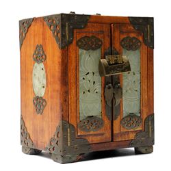 Chinese tabletop greenstone panelled cabinet with brass mounts, feather pulls, revealing t...