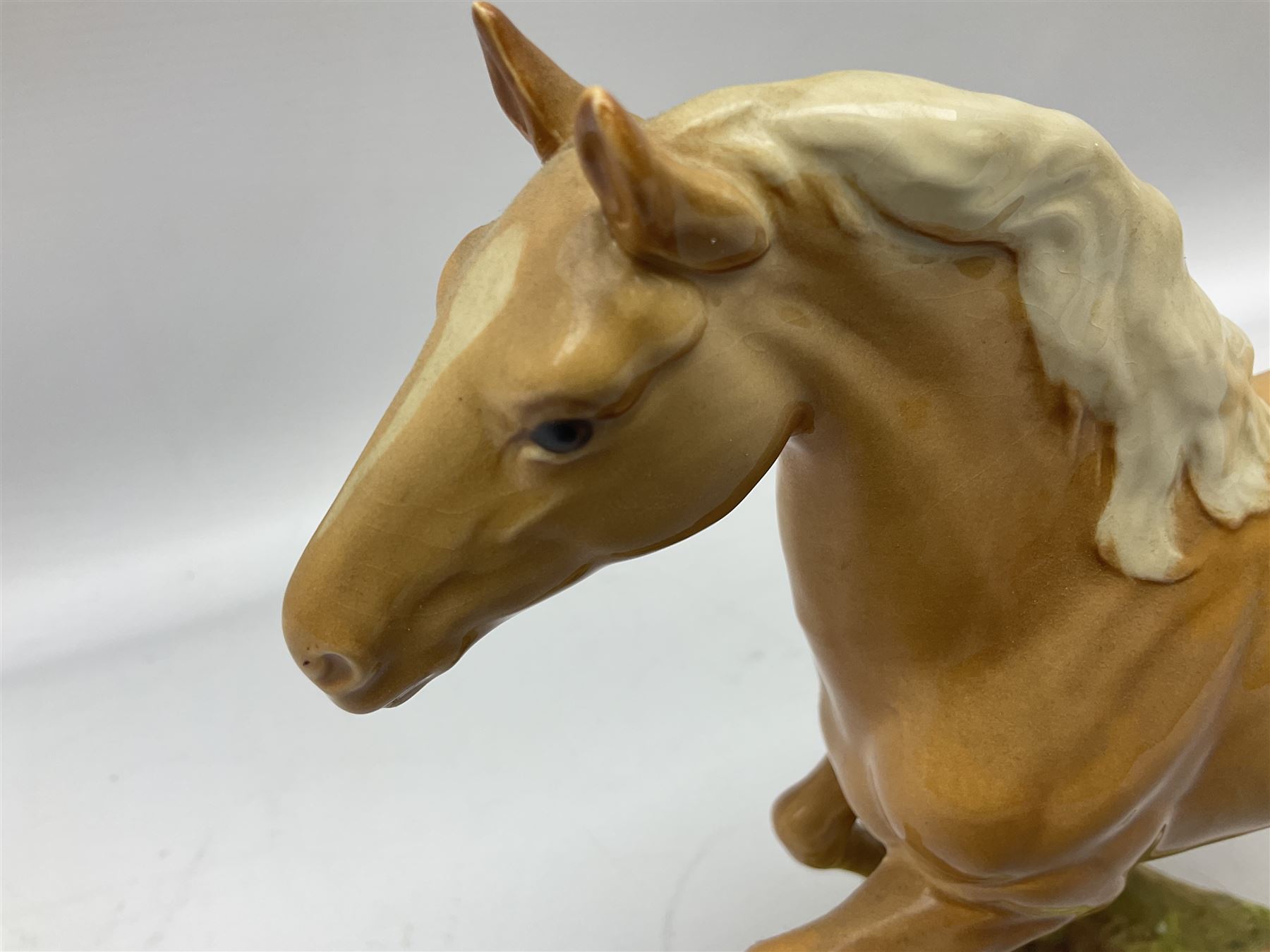 Beswick figure of cantering Palomino horse on base model no 1374, with impressed and printed mark beneath, H18cm